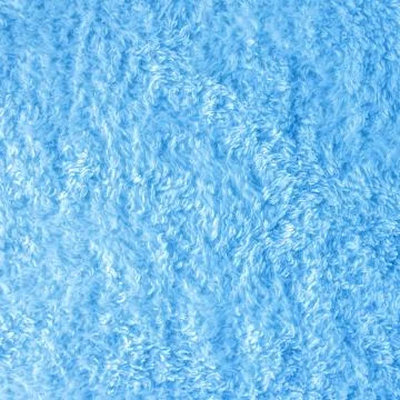 White delicate soft  background of plush fabric Stock Photos