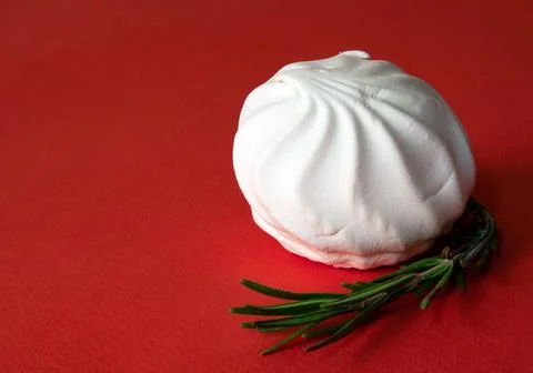 White delicate zephyr and tiny rosemary sprig Stock Photos