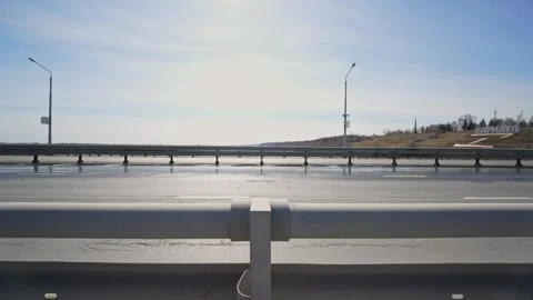 White delivery van driving on bridge road during bright day Stock Footage 332434204