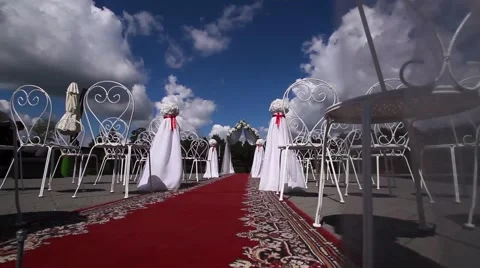 White design wedding ceremony, a red carpet. A bright Sunny day, blue sky. Stock Footage 65336896