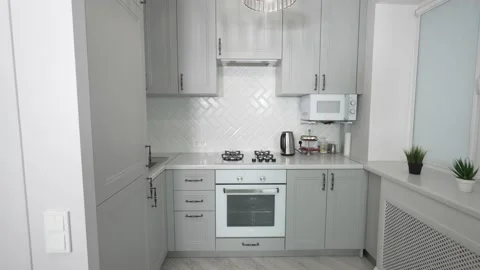 White designer kitchen, marble countertop with grey markings, interior home Stock Footage 231329315