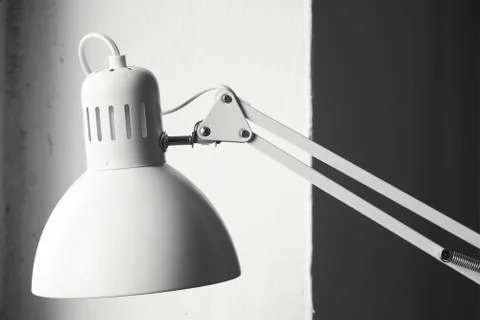 White desk lamp on black and white background, BW concept Stock Photos