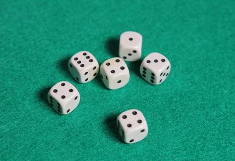 White dices on a green mat Stock Photos