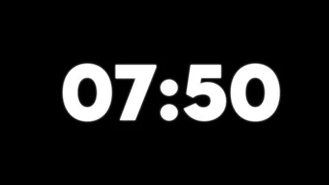 White digital clock showing 0750 on black background Stock Illustration