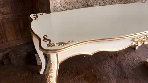 White dining table with a touch of gold carving Stock Footage 228824104