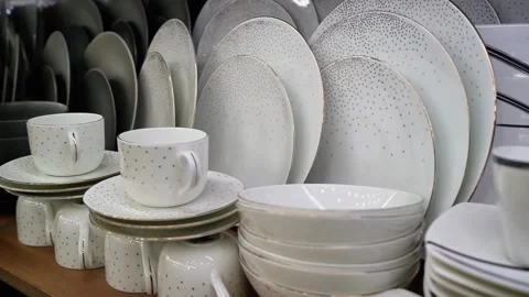 White dinner set decorated with tiny black dots Stock Footage 320958514