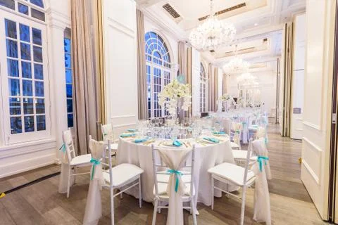 White dinner, wedding event table decorated with orchids Stock Photos