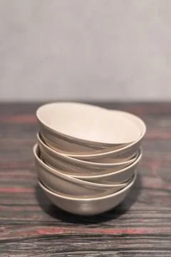 White dish on a dark background Stock Photos