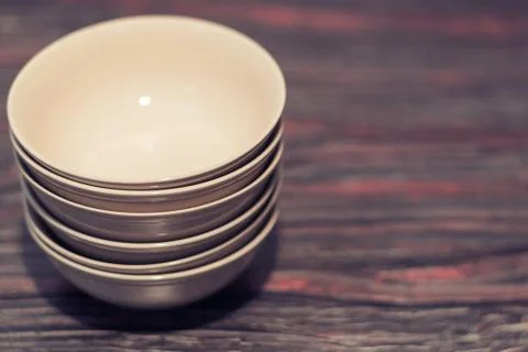 White dish on a dark background Stock Photos