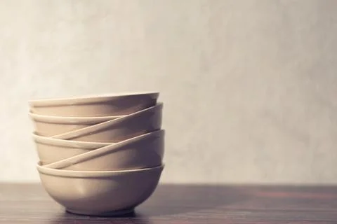 White dish on a dark background Stock Photos