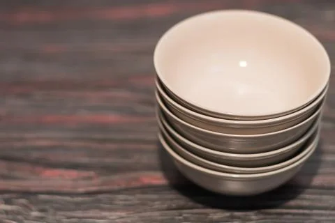 White dish on a dark background Stock Photos
