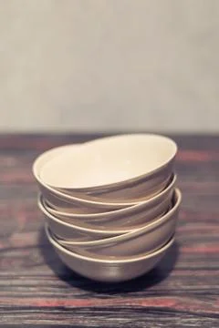 White dish on a dark background Stock Photos