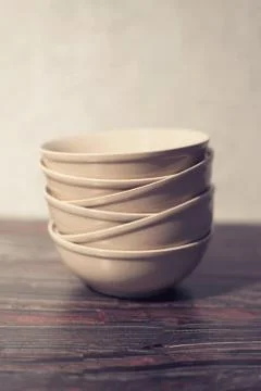 White dish on a dark background Stock Photos