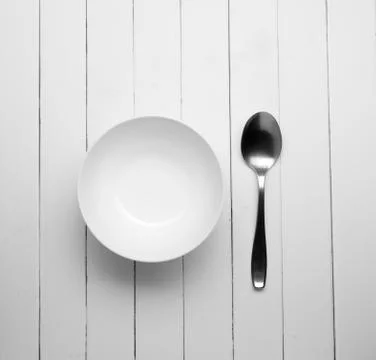 White dish with old spoon Stock Photos