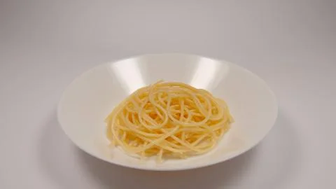 White dish with a spaghetti on a table Stock Photos