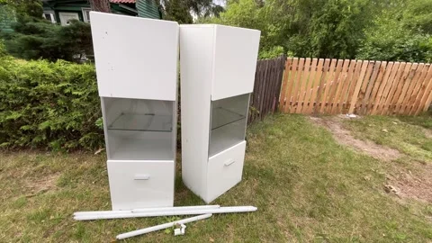 White display cabinets left for bulky waste collection (Sperrmüll) in Germany Stock Footage 339659416