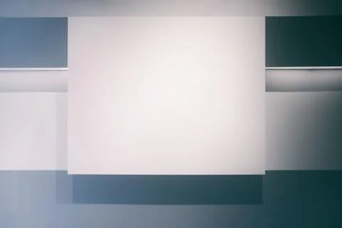 White Display on Wall in Empty Room Background with Light Leak. Stock Photos