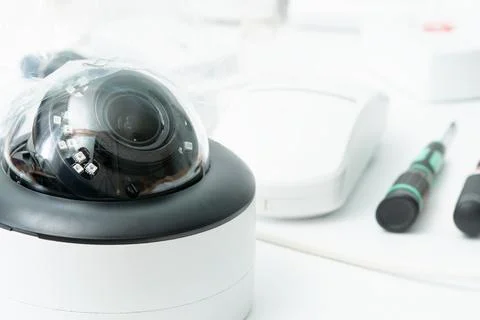 White dome security camera. Home security system. Stock Photos