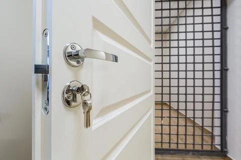 The white door with grid that is as prison cell. Concept of house arrest. Stock Photos