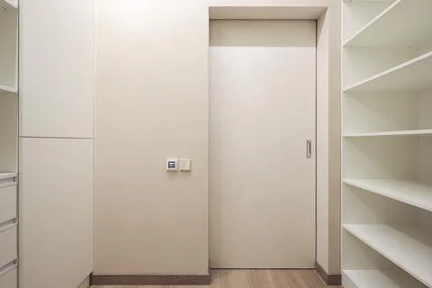 White door inside dressing room in the interior Stock Photos