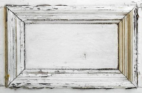A white door panel with old weathered and cracked paint Stock Photos