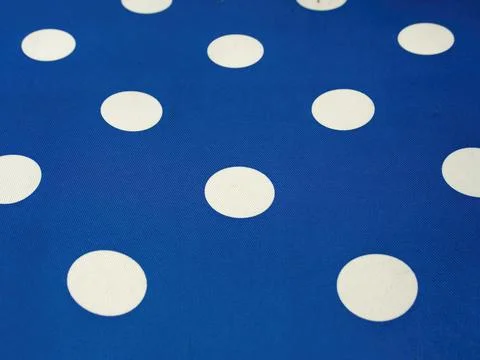 White dot pattern on the fabric of a lounge chair, captured at a garden near  Foto stock