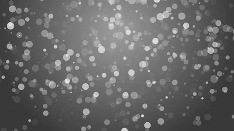 White dots Christmas background. Subtle flying snow flakes on grey background. Stock Footage 290120192