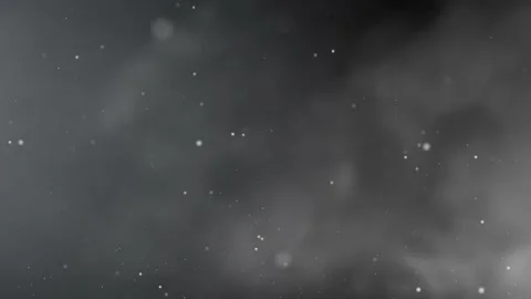 White dotted particles floating to the top in a black backround with smoke Stock Footage 143194942
