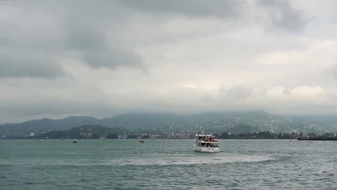 White double-decker pleasure boat sails somewhere in Black Sea Stock Footage 119659697
