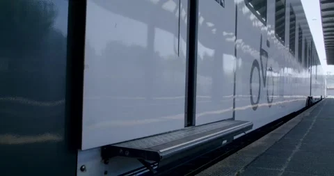 White Double Decker Train With Open Door, Bicycle Symbol on Side, Close Up Shot Видео 340661181