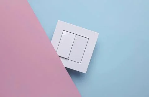 White double light switch on blue and pink background Stock Photos