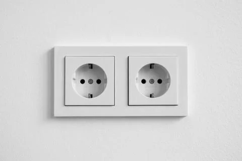 White double socket on wall - electric plug Stock Photos