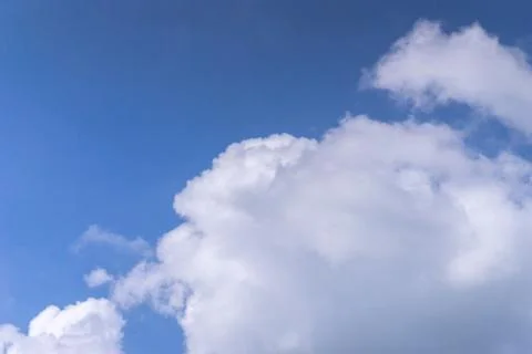 White dramatic cloud on bright blue sky background with copy space 写真素材
