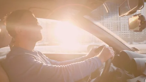 White driver slows down letting other cars to pass by. Man smiles and continue Stock Footage 109417250