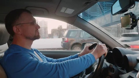 White driver is at steering wheel of car which is overtaken by cars going the Stock Footage 109417431