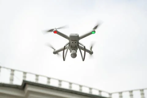 White drone on the background of sky. Closeup. Stock Photos