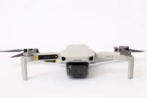 White drone with camera on a plain white background Stock Photos