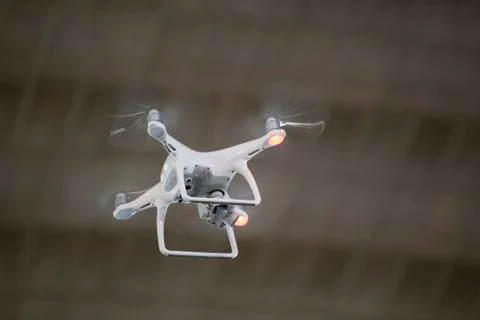 White drone with digital camera flying Stock Photos