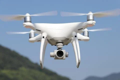 White drone flying in air Stock Photos