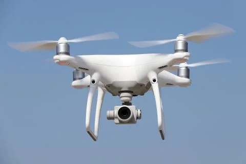White drone flying in air Stock Photos