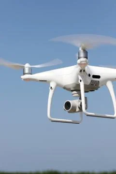 White drone flying in air Stock Photos