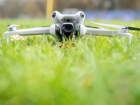 White drone is on the grass Stock Photos