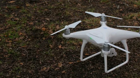 White drone takes off in the forest Stock Footage 87796937