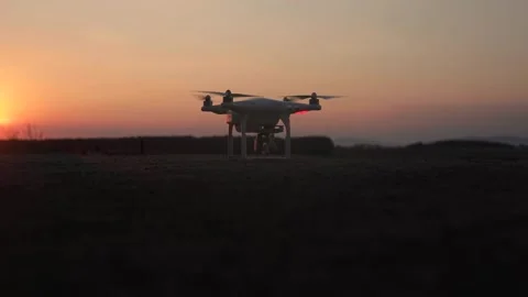 White drone taking off during summer sunset Stock Footage 146045345