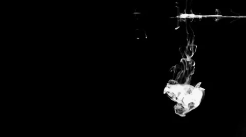 White Drop of Ink on Black Background - Underwater Shot Stock Footage 33140343
