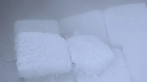White dry ice cubes that are melting and atomizing Video stock 341952646
