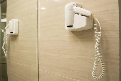 White dryer fixed on wall Stock Photos