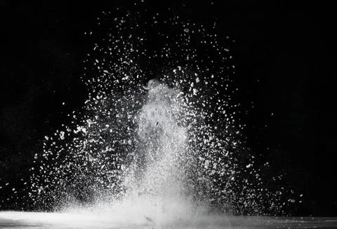 White dust exploding on surface impact Stock Photos