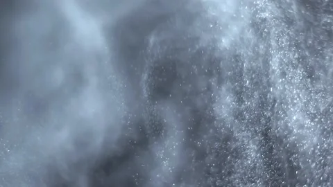 White dust particles dancing in the air Stock Footage 138552099