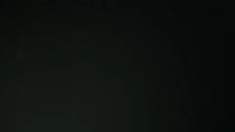 White Dust Particles Flying On Black Background. Slow motion. Stock Footage 74670436